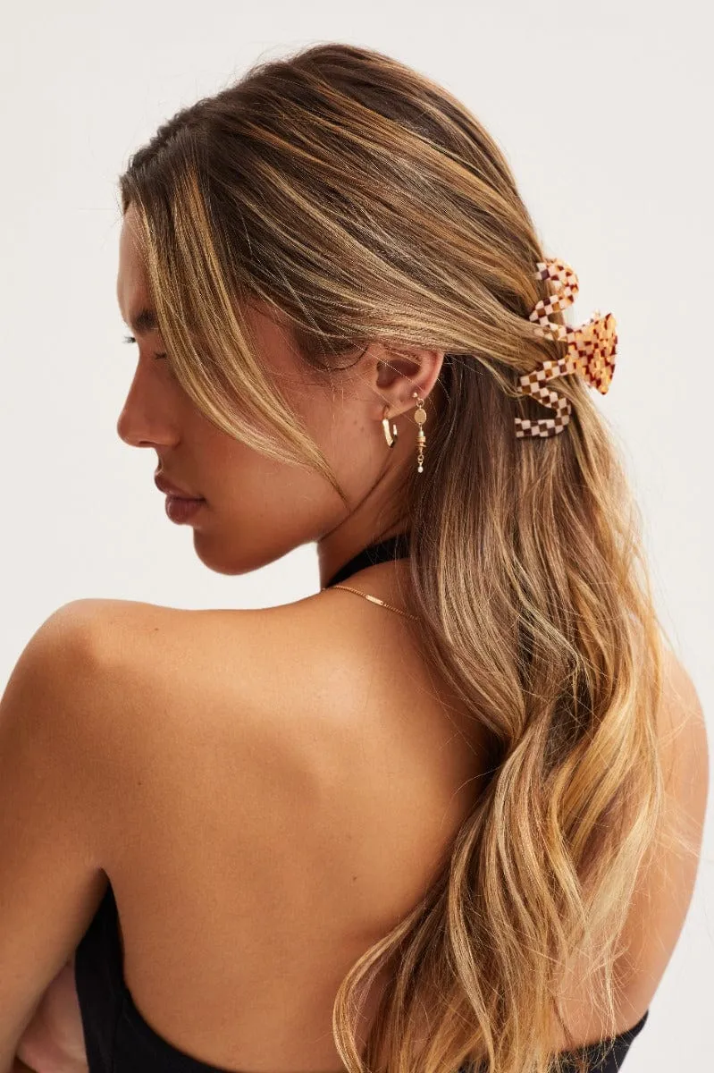 White Check Swirl Claw Clip sold by Ally Fashion