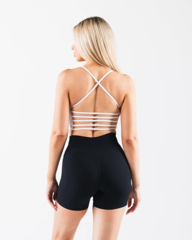 Aura Strappy Longline Bra - White sold by Alphalete