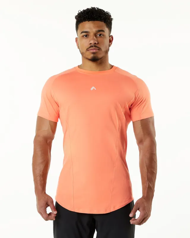 Velocity Tee - Electric Peach sold by Alphalete