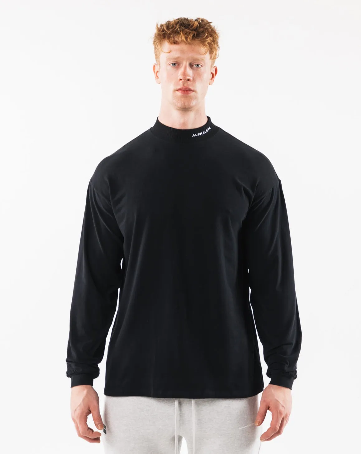 Brushed Core Mock Neck LS - Black sold by Alphalete