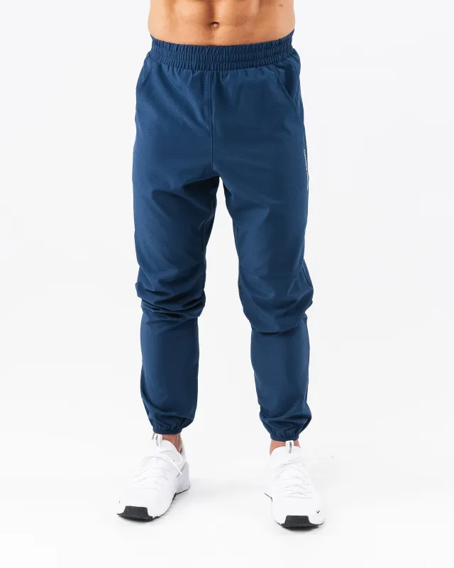 Infinity Tech Pant - Denim sold by Alphalete