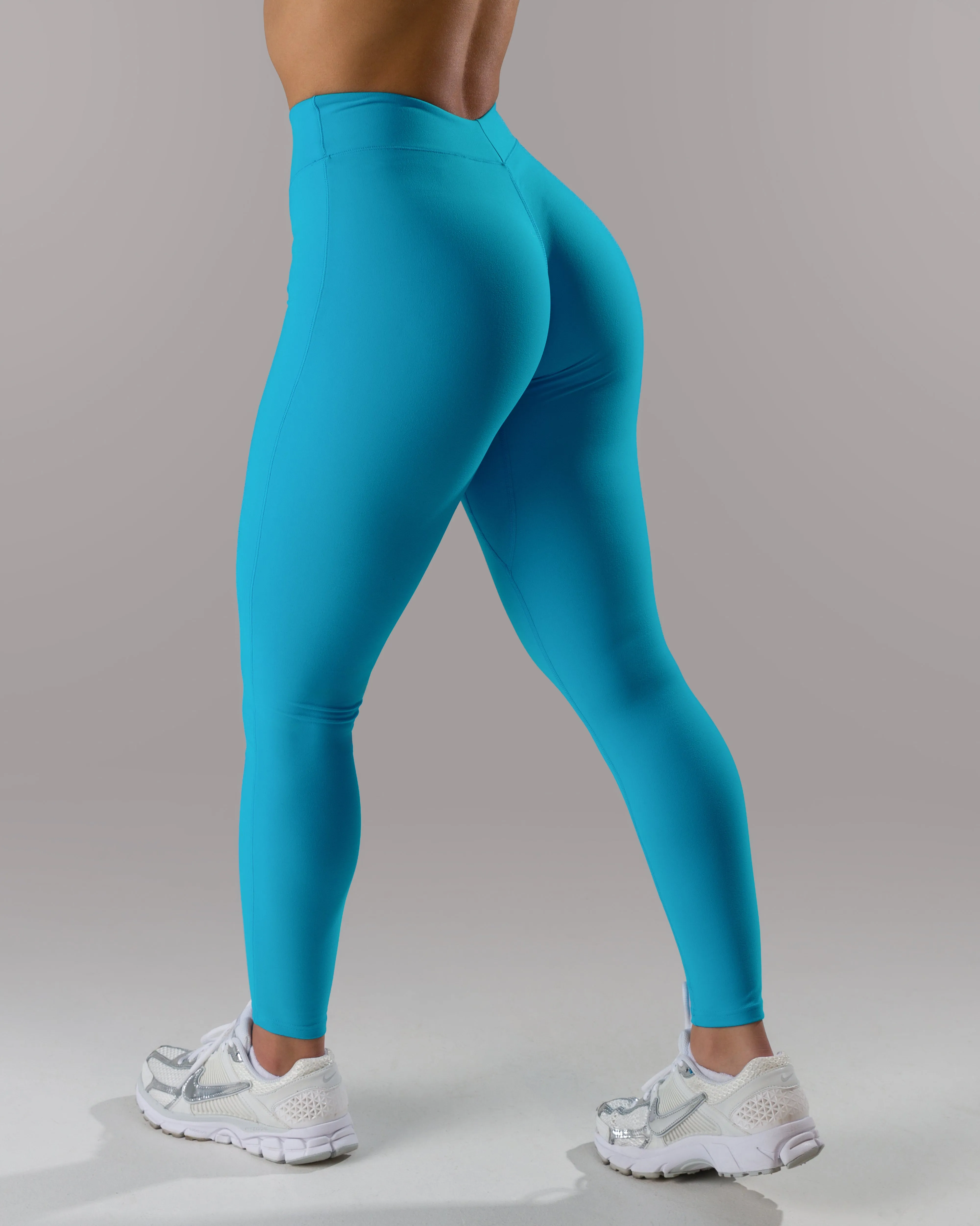 Dip Back Mid Rise Legging - Cerulean sold by Alphalete