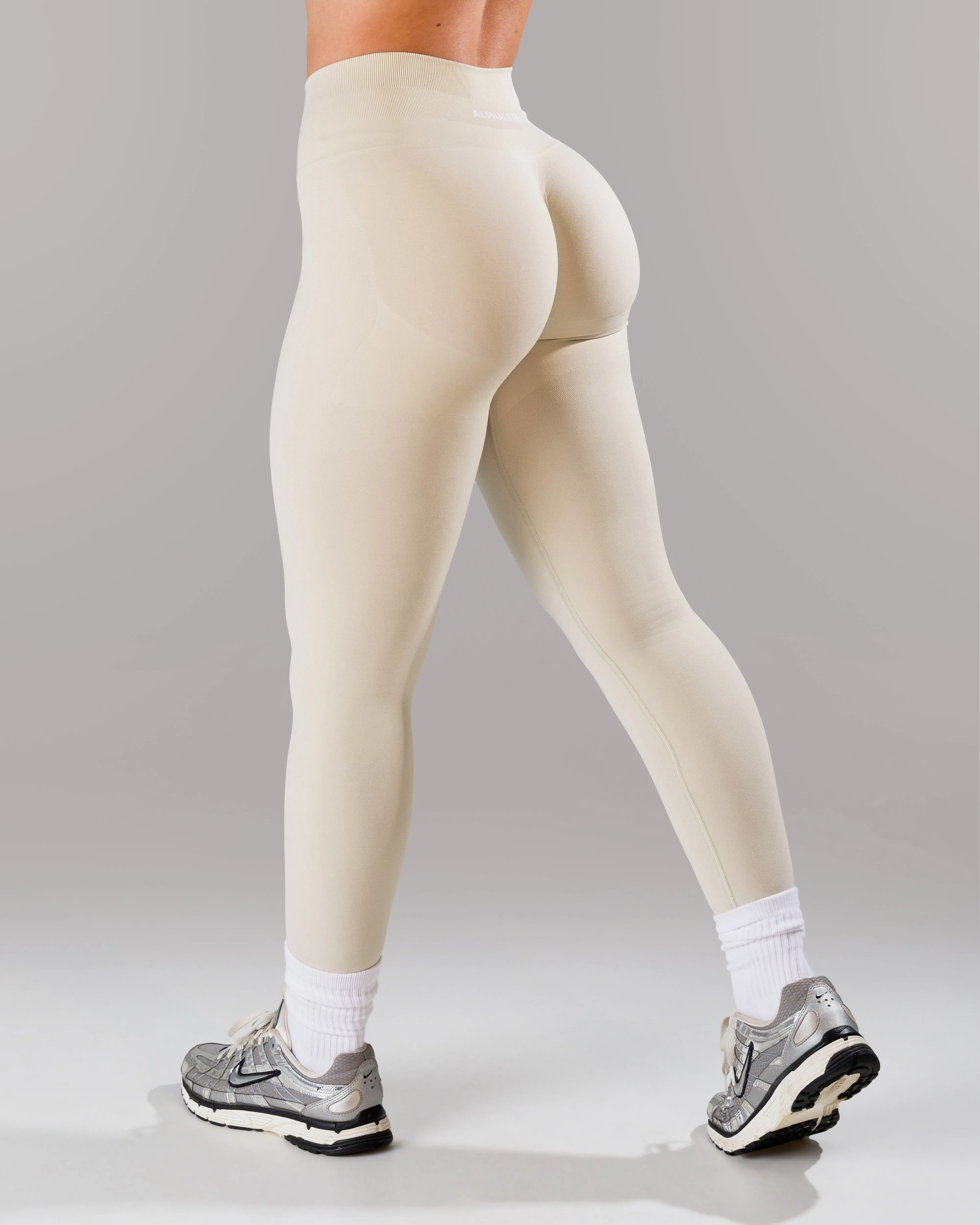 Pump Mid Rise Legging - Wheat sold by Alphalete