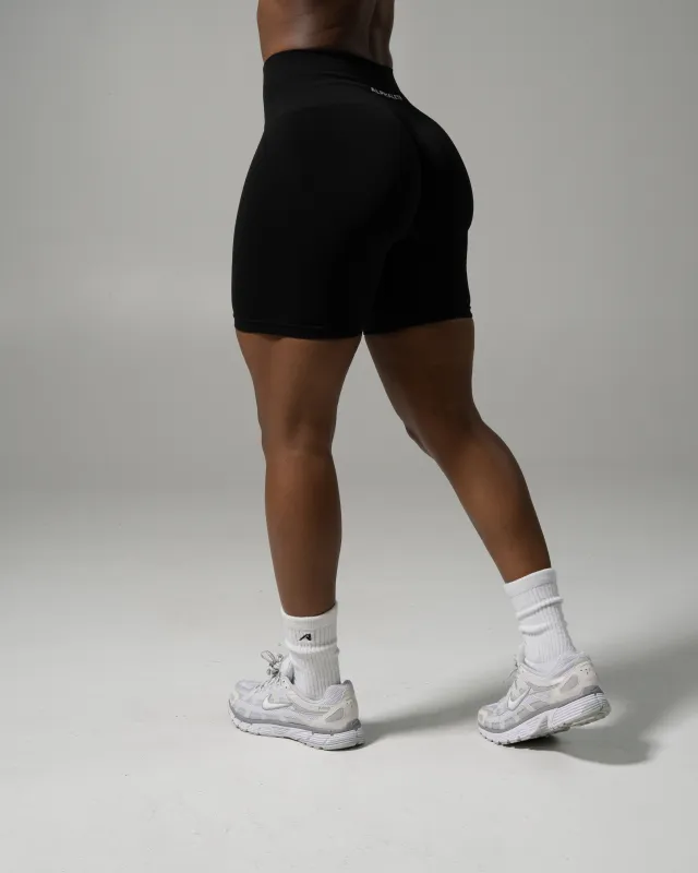 Pump Mid Rise Biker Short - Black sold by Alphalete