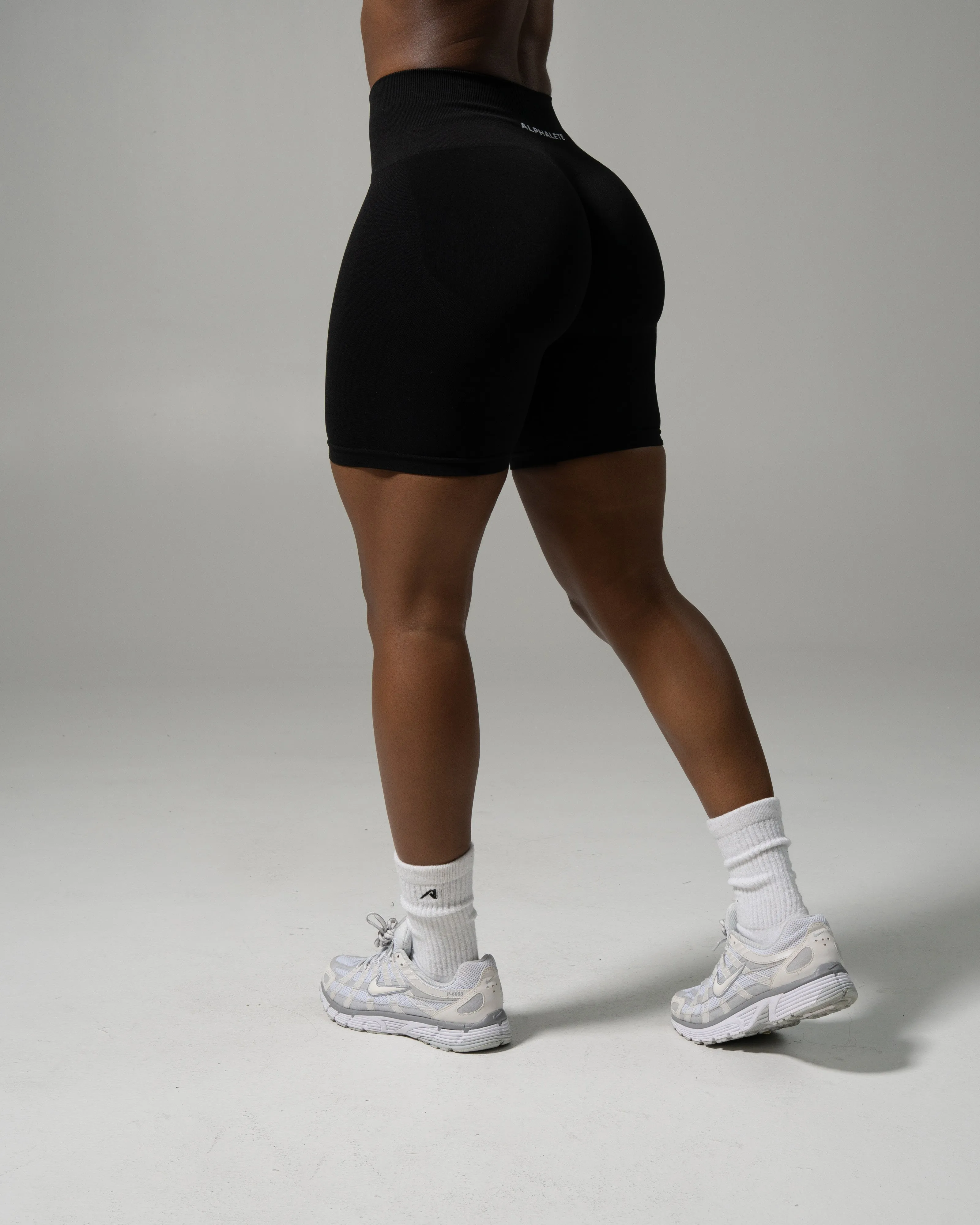 Pump Mid Rise Biker Short - Black sold by Alphalete