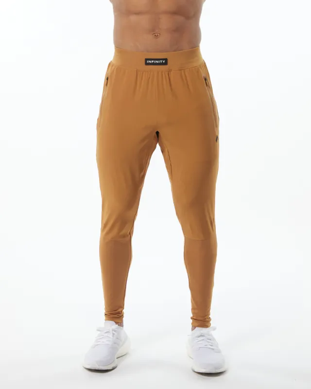 Infinity Tech Pant - Chestnut sold by Alphalete