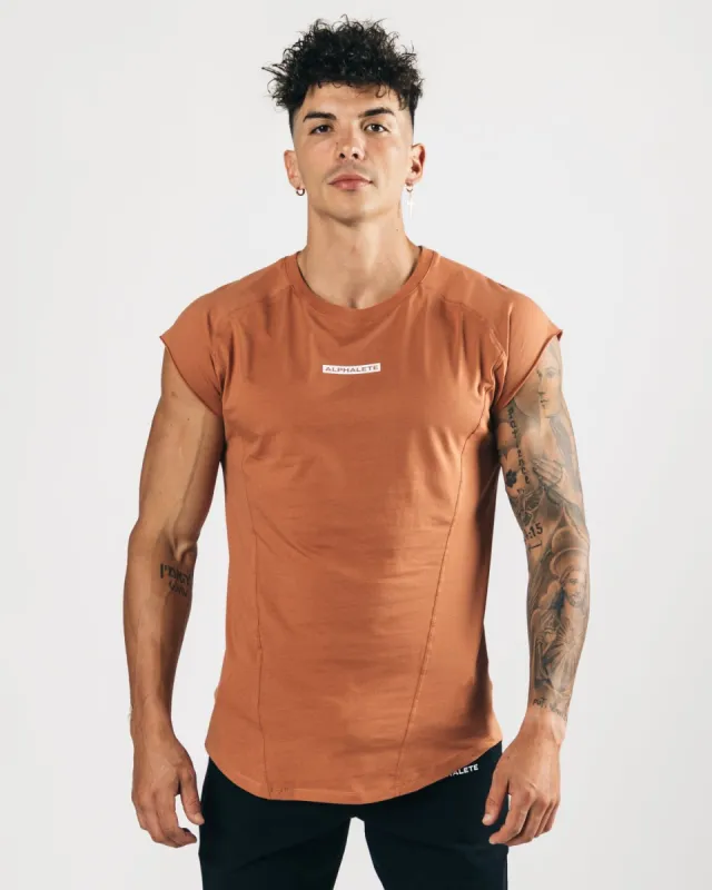 Velocity Sleeveless Tee - Clay sold by Alphalete