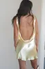 The Andie Anderson Yellow Satin Open Back Dress sold by Amazing Lace