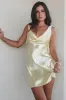 The Andie Anderson Yellow Satin Open Back Dress sold by Amazing Lace