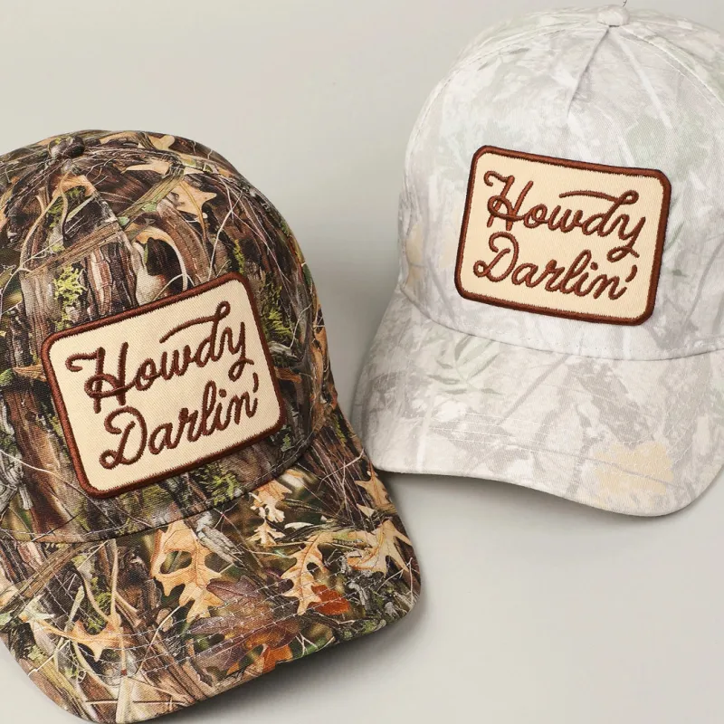Howdy Darlin’ Camo Embroidered Patch Trucker Hat sold by Amazing Lace