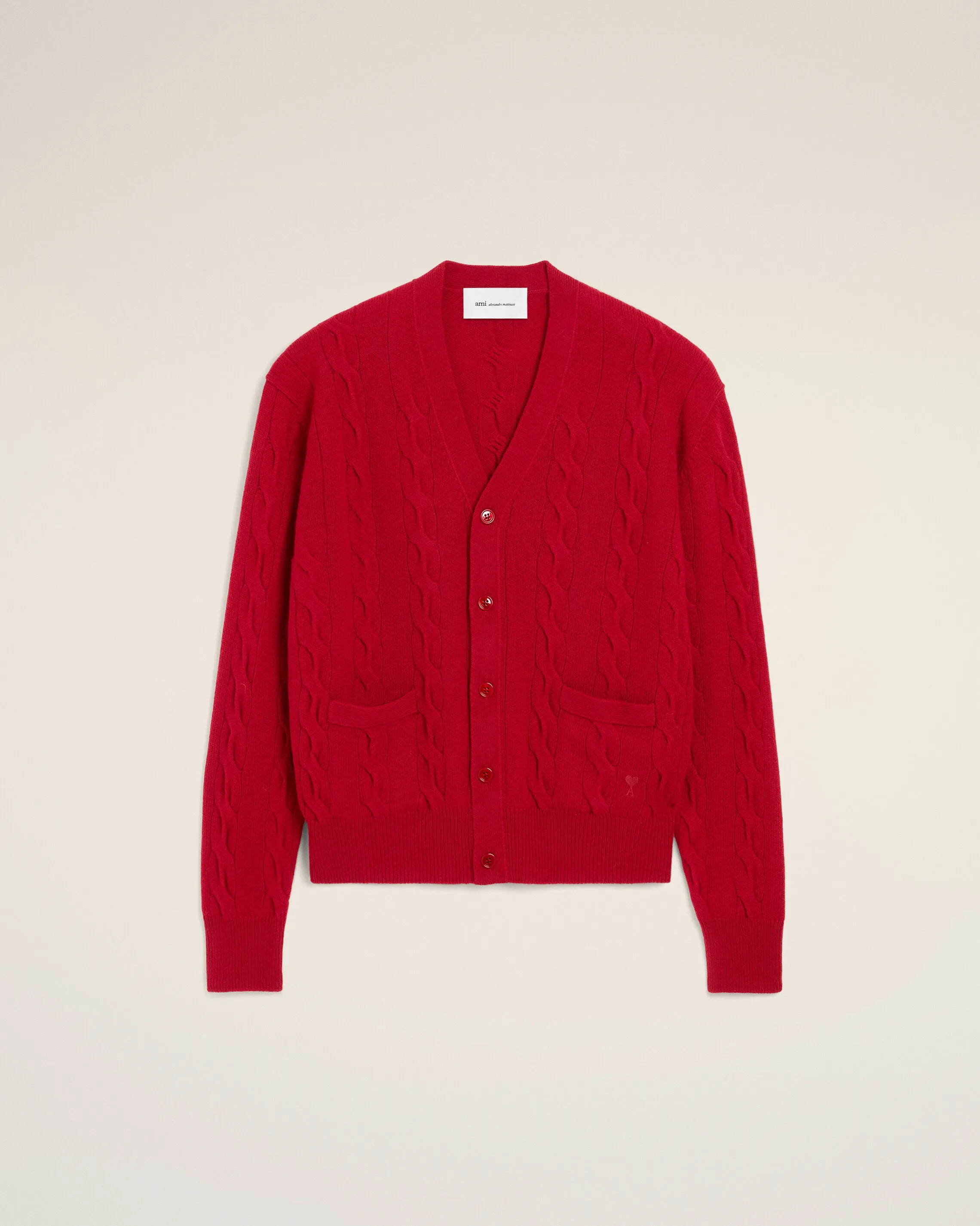 Cardigan torsadé rouge en laine sold by Ami