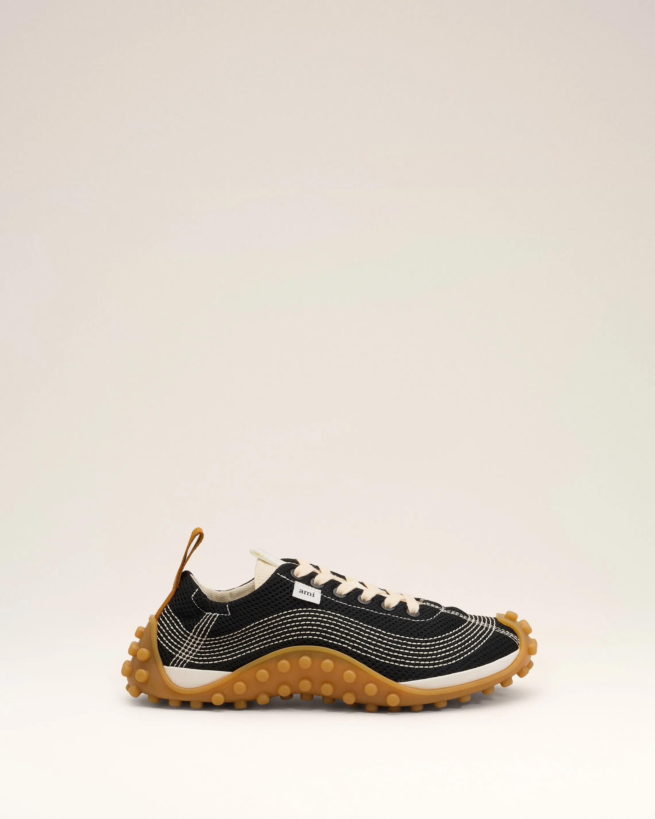 Sneakers Mirage noires en mesh sold by Ami