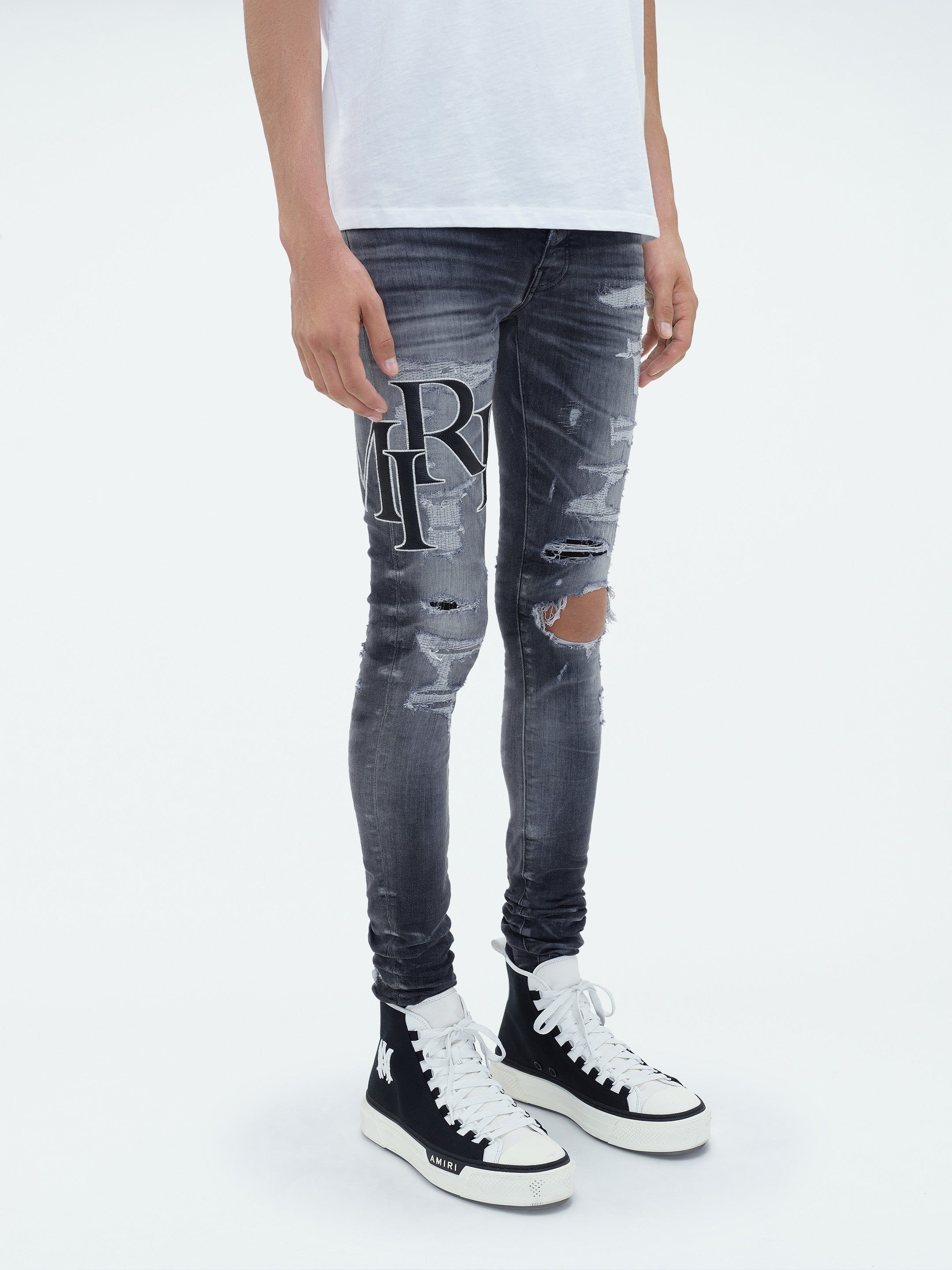 AMIRI STAGGERED LOGO JEAN STORM GREY Parallel