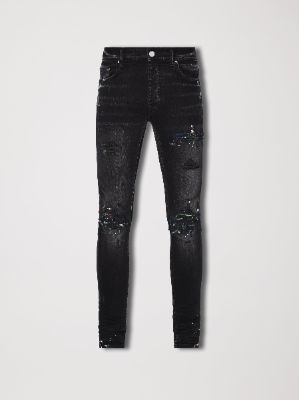 PAINT SPLATTER MX1 - AGED BLACK made by AMIRI