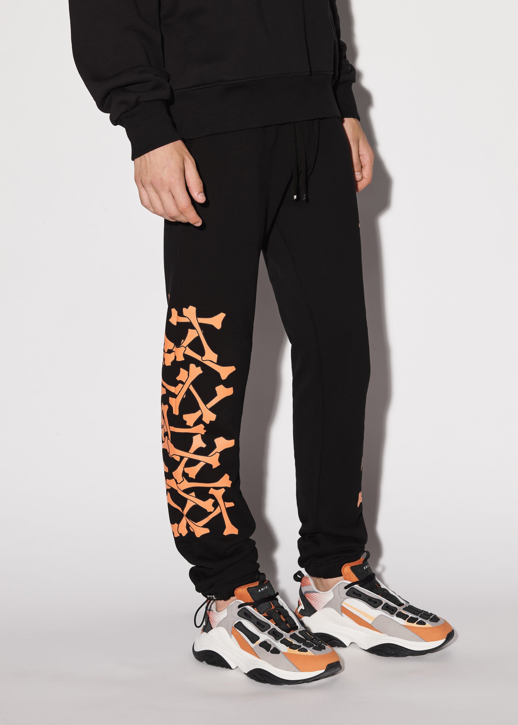 AMIRI アミリ BONES SWEAT PANTS ボーン スウェットパンツ ブラック/オレンジ AMIRI BONES SWEATPANTS - BLACK ORANGE | Parallel