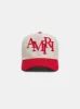 STAGGERED AMIRI CANVAS HAT - Alabaster Red sold by AMIRI