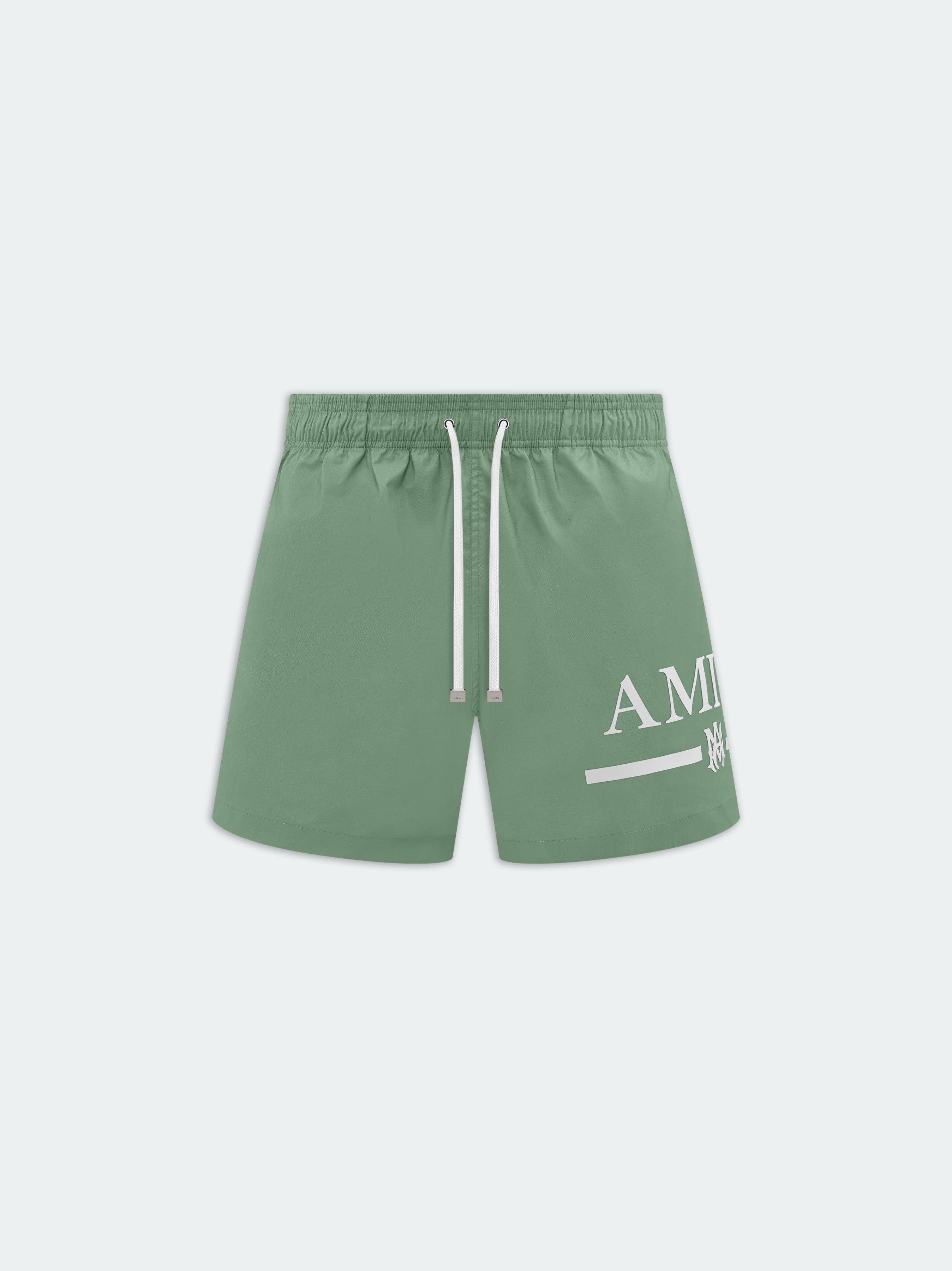 MA BAR LOGO SWIM TRUNK - Mineral Green sold by AMIRI