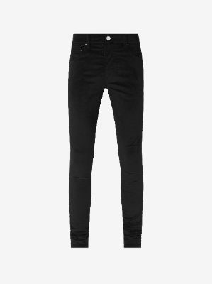 VELOUR SKINNY STACK - BLACK made by AMIRI