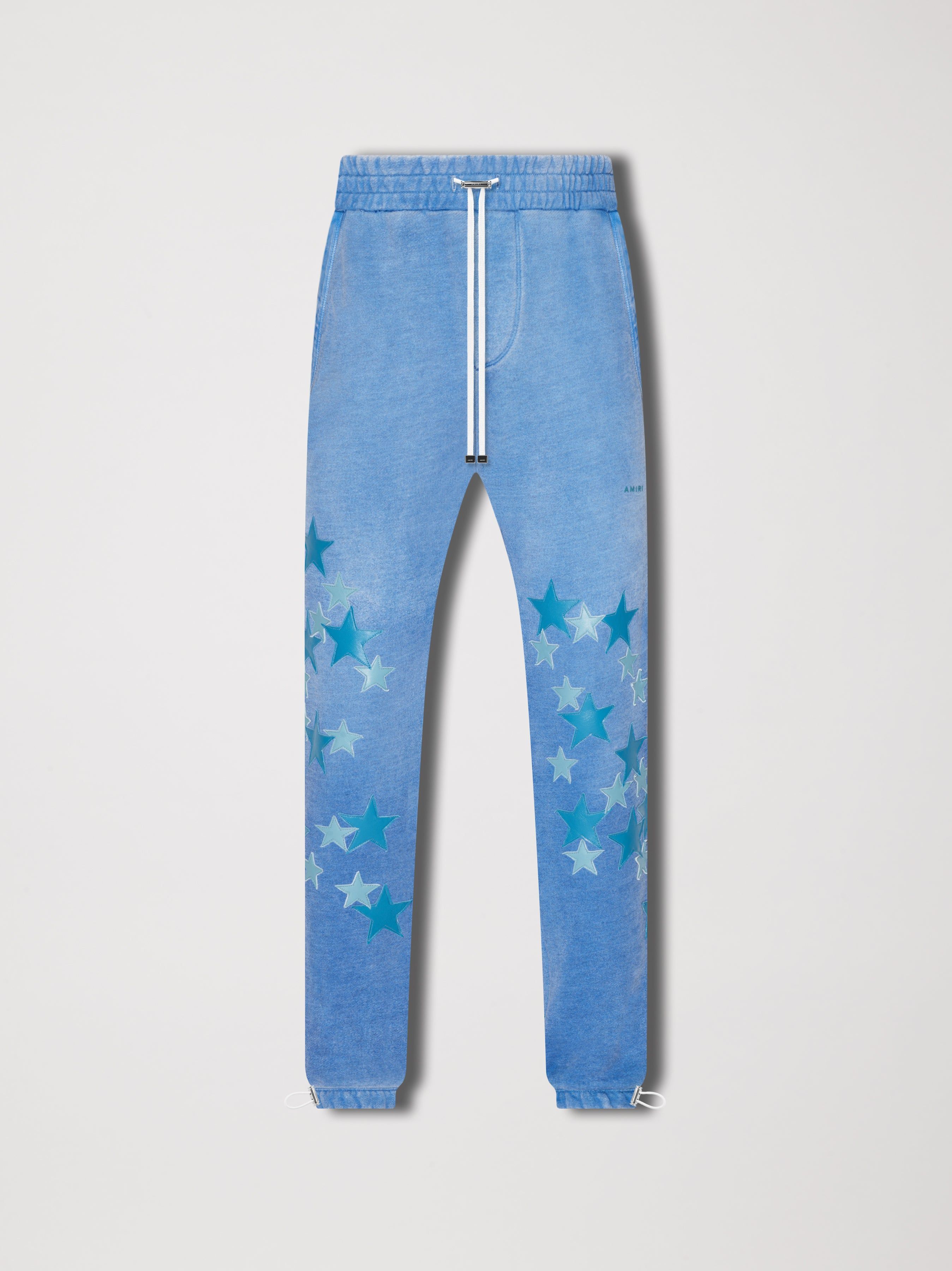 PIGMENT SPRAY STAR SWEATPANTS - HEATHER CAROLINA BLUE sold by AMIRI