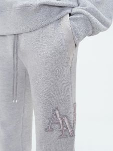 AMIRI STAGGERED SWEATPANT - HEATHER GREY sold by AMIRI