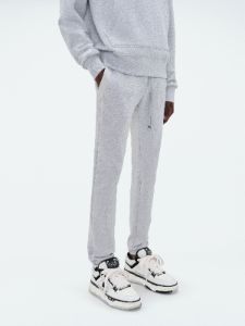 AMIRI STAGGERED SWEATPANT - HEATHER GREY sold by AMIRI