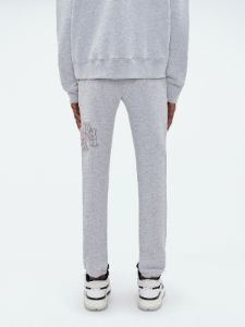 AMIRI STAGGERED SWEATPANT - HEATHER GREY sold by AMIRI