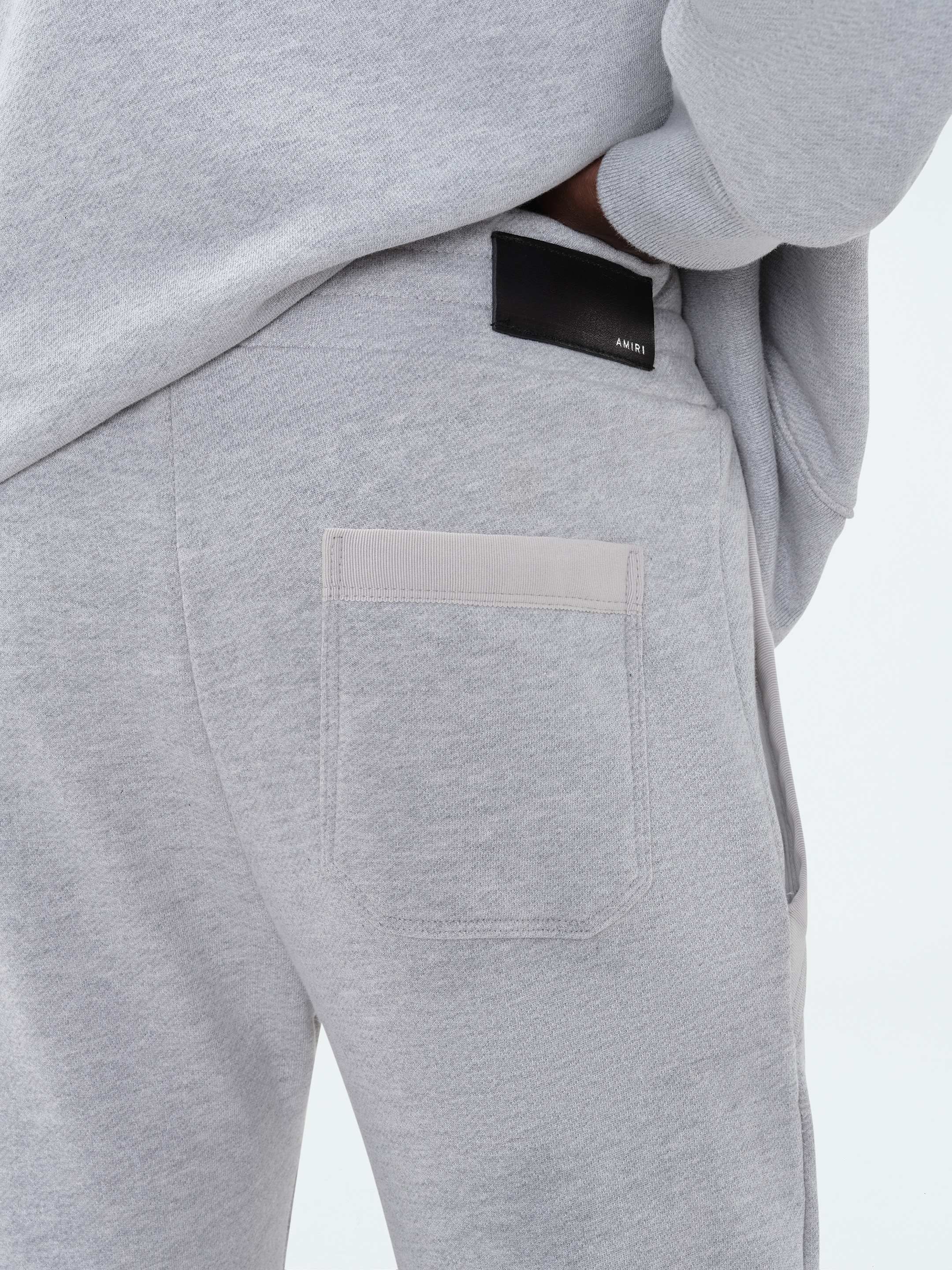AMIRI STAGGERED SWEATPANT - HEATHER GREY sold by AMIRI product image thumbnail 9