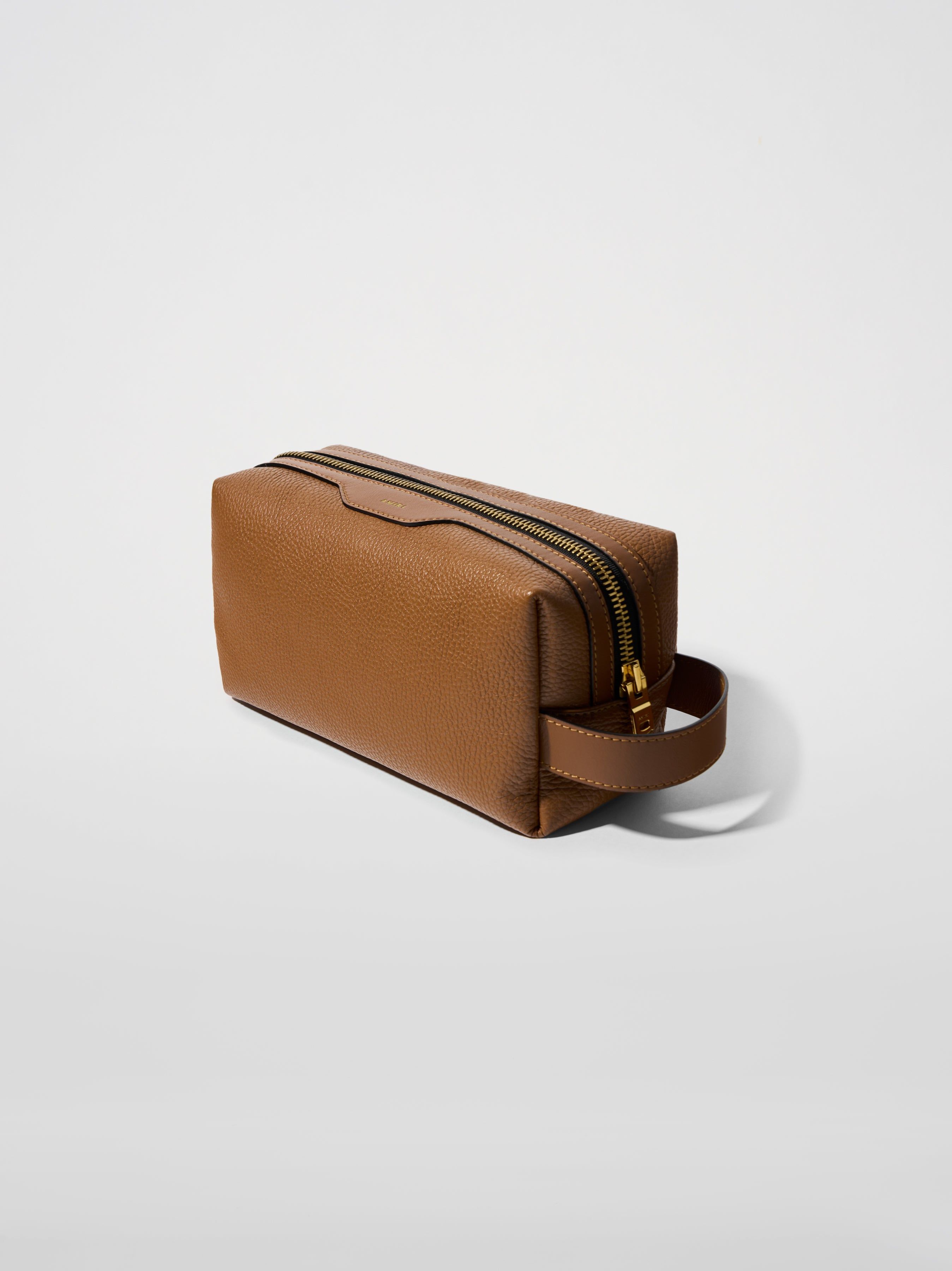 PEBBLED NAPPA DOPP KIT - BROWN sold by AMIRI