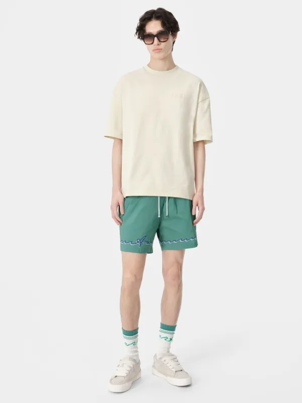 AMIRI WAVE SWIM TRUNK - Sea Blue sold by AMIRI