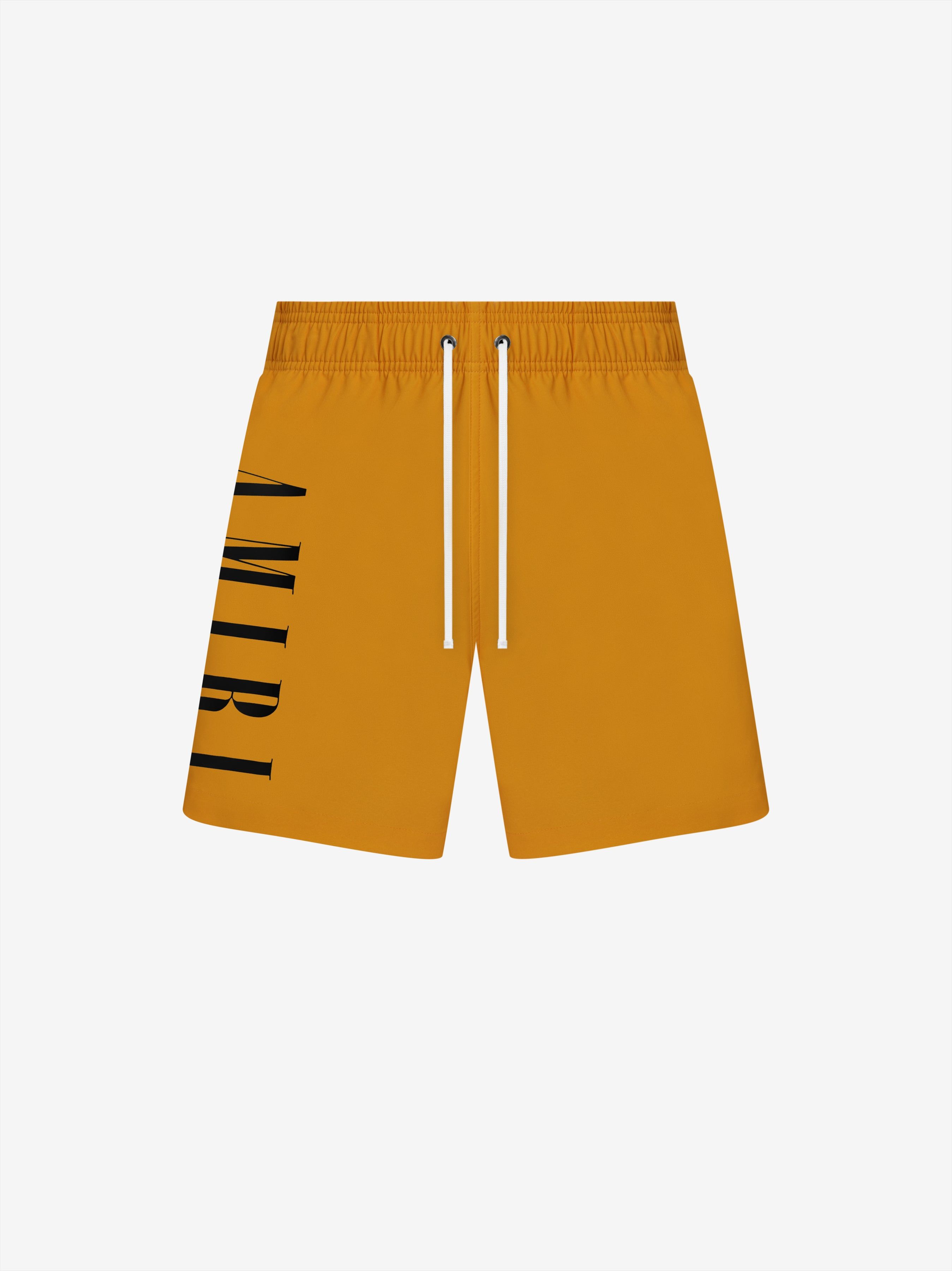 VERTICAL LOGO SWIM TRUNKS - GOLD sold by AMIRI