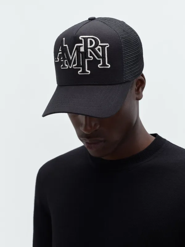 STAGGERED AMIRI LOGO TRUCKER - Black/Alabaster sold by AMIRI