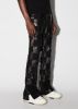 MIXED CHECK PATCH FLARE PANTS - BLACK sold by AMIRI