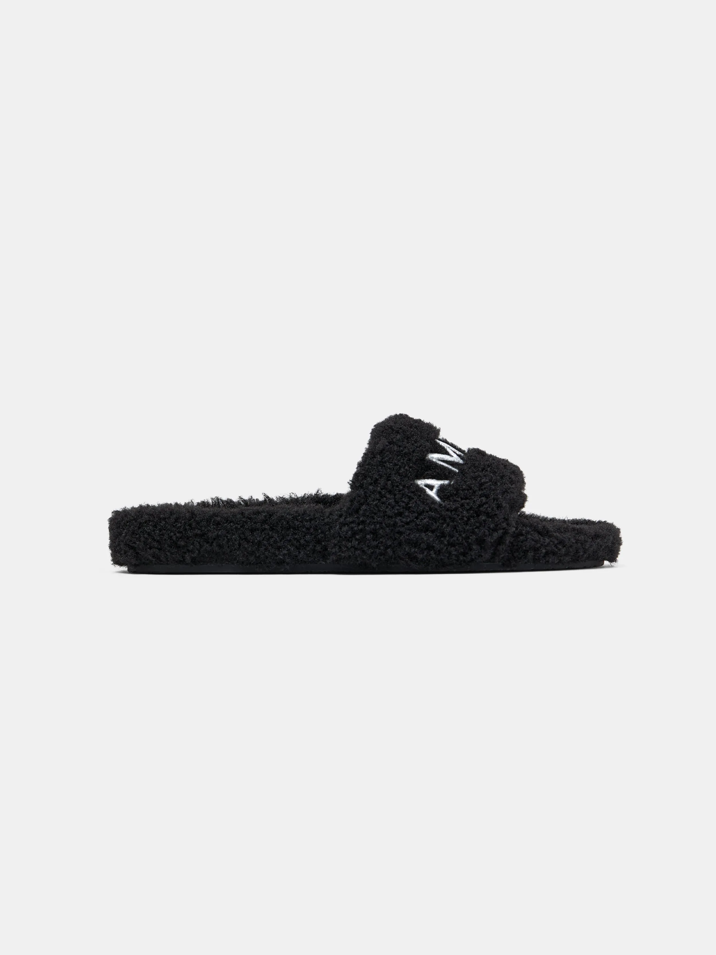 WOMEN - WOMEN'S AMIRI SHEARLING SLIDE - Black sold by AMIRI