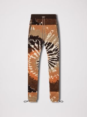 TIE DYE POLAR FLEECE PANTS - ORANGE / BLACK made by AMIRI