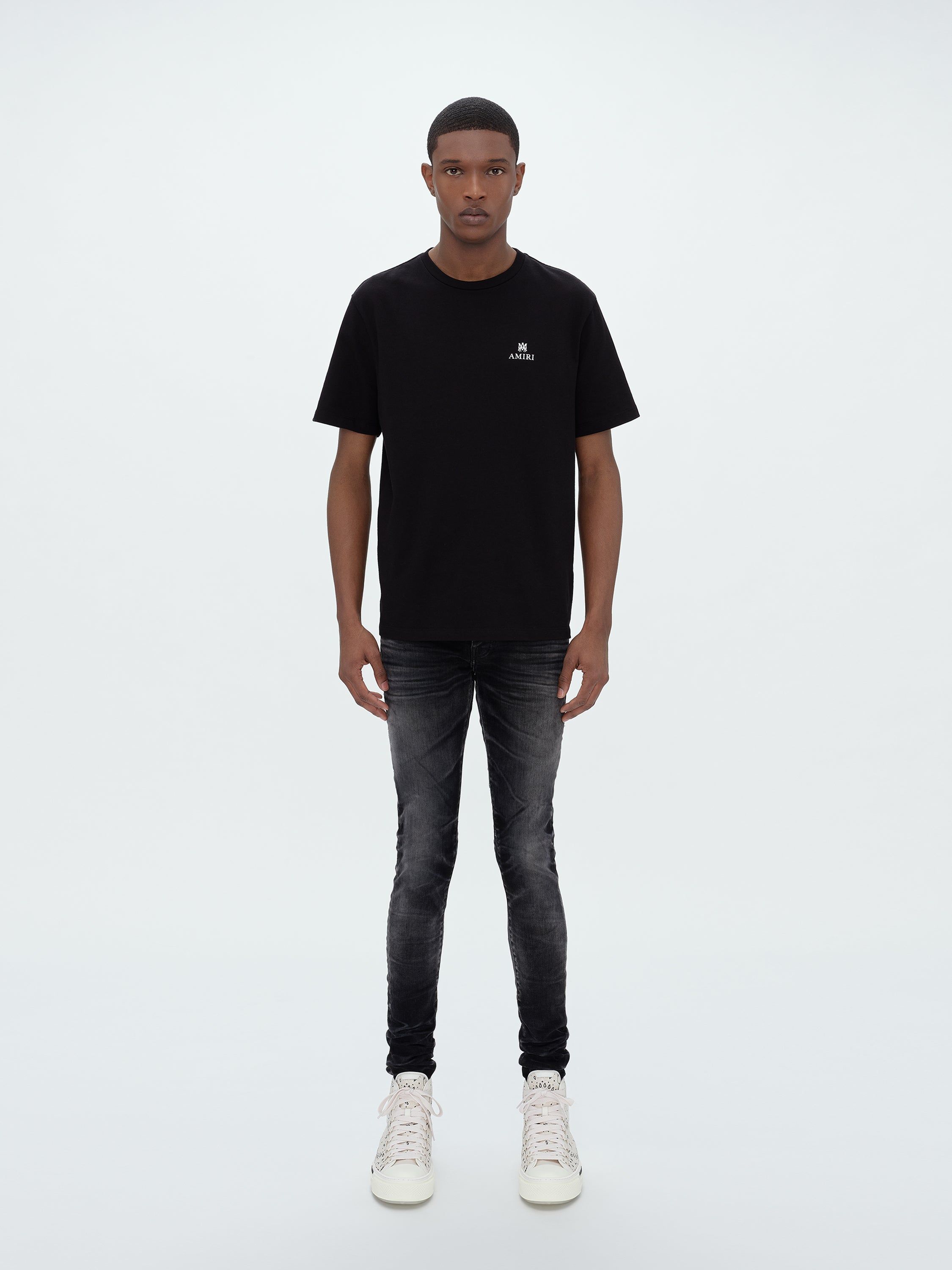 STACK JEAN - FADED BLACK sold by AMIRI