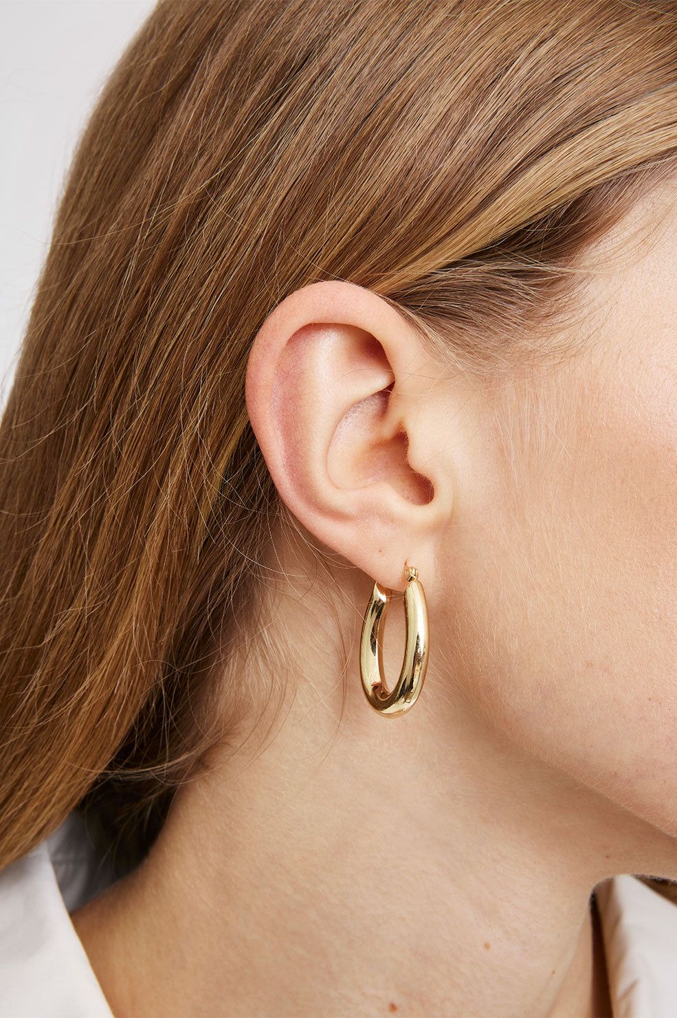 Tubular Oval Hoop Earrings - 14k Gold sold by Anine Bing product image thumbnail 2