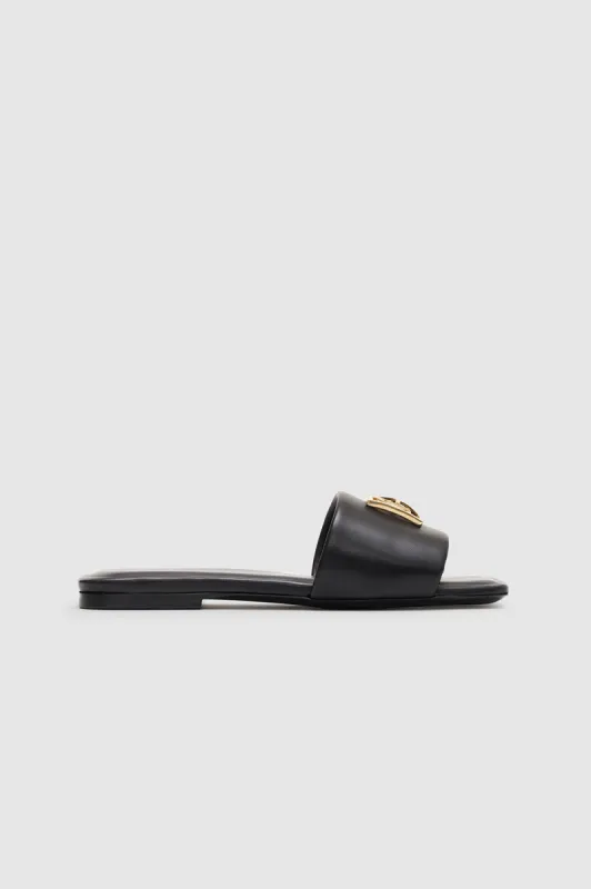 Ria Slides Monogram - Black sold by Anine Bing