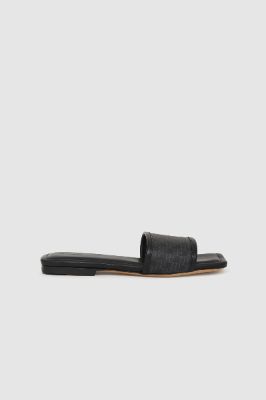 Ria Slides - Black Monogram Print sold by Anine Bing