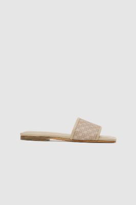 Ria Slides - Beige Monogram Print sold by Anine Bing
