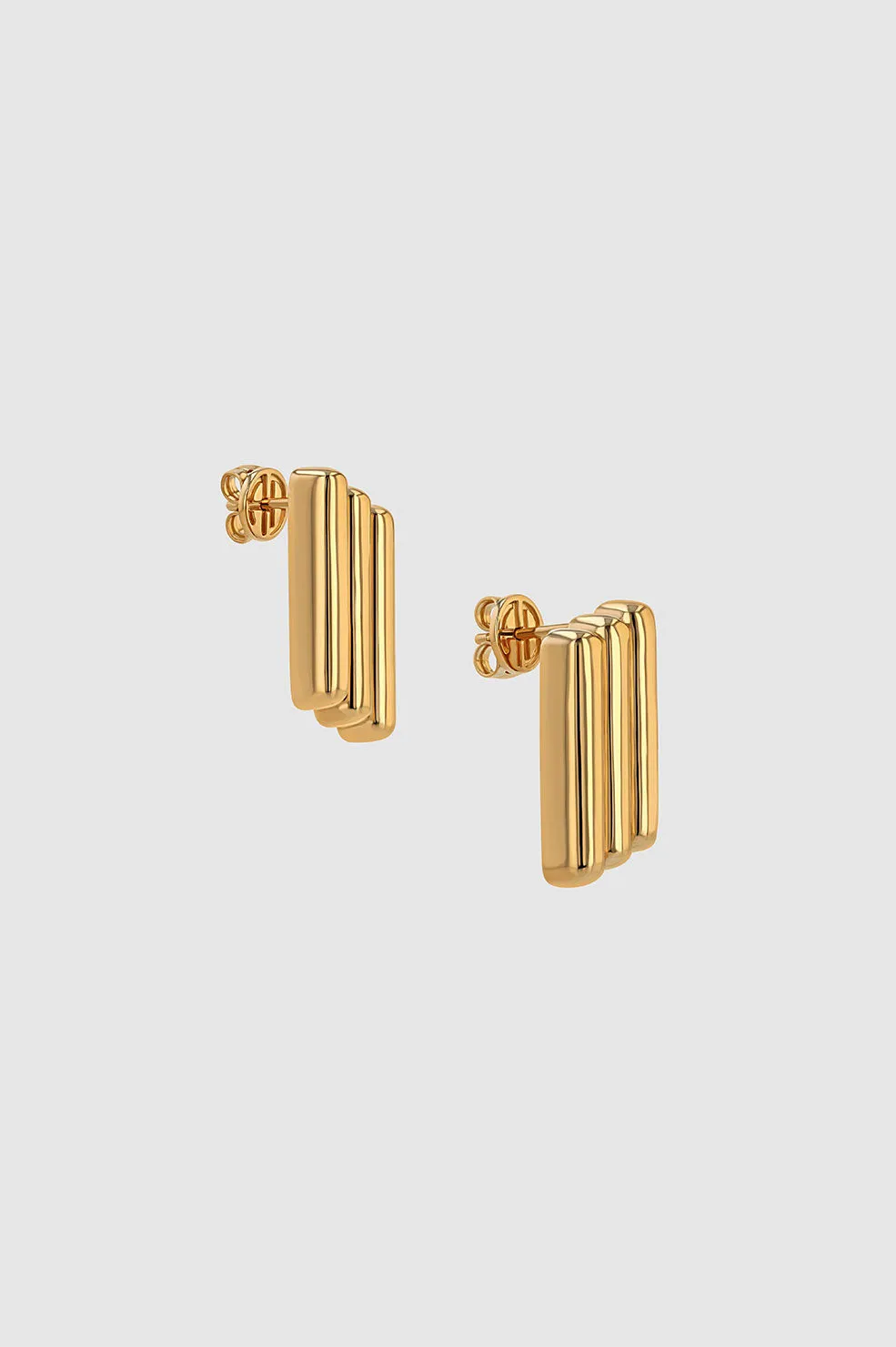 Diagonal Coil Earrings - Gold sold by Anine Bing