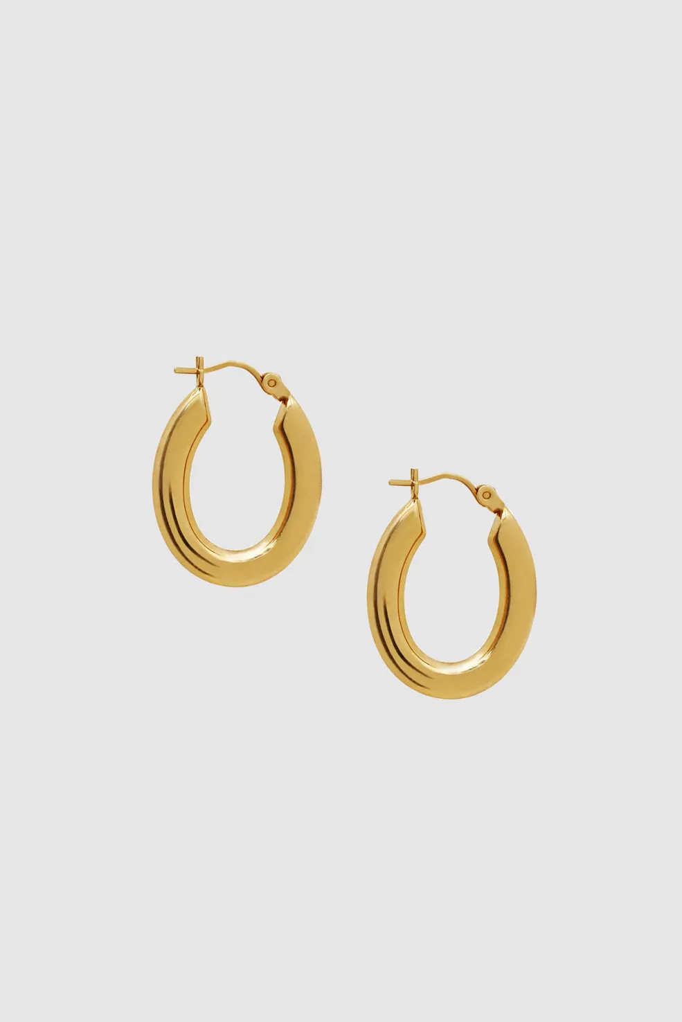 Small Tubular Oval Hoop Earrings - 14k Gold sold by Anine Bing