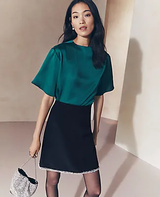 Ann Taylor Petite Crystal-Embellished Hem A-Line Skirt sold by Ann Taylor