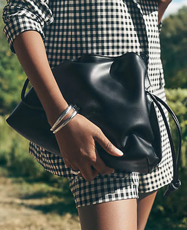 Ann Taylor Drawstring Faux Leather Clutch Bag sold by Ann Taylor