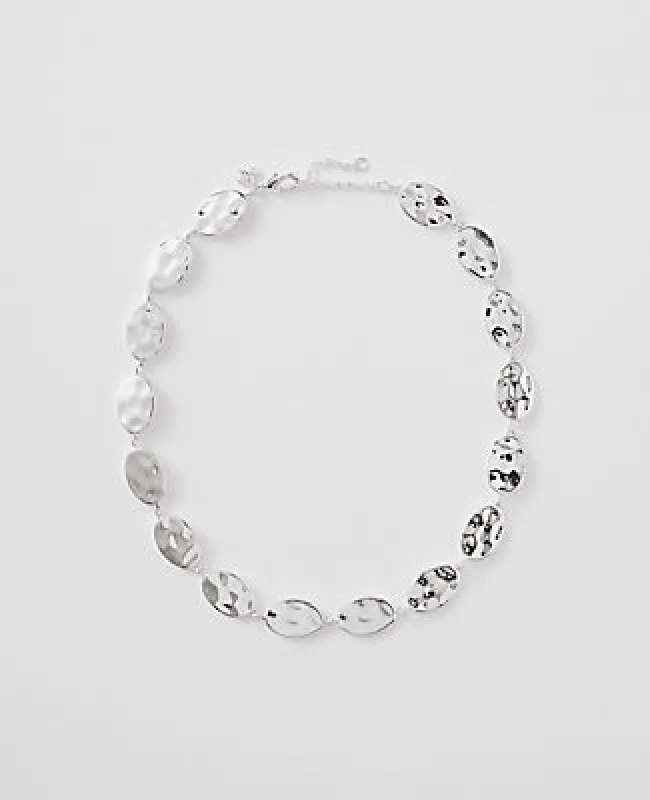 Ann Taylor Textured Metal Disc Necklace sold by Ann Taylor