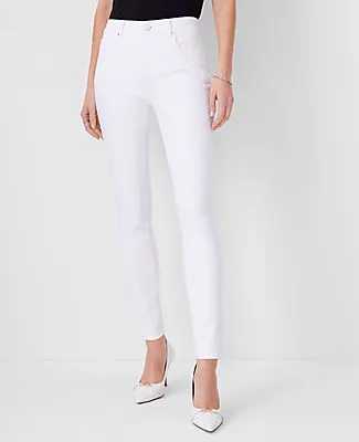 Ann Taylor Petite Mid Rise Skinny Jeans in White - Curvy Fit sold by Ann Taylor
