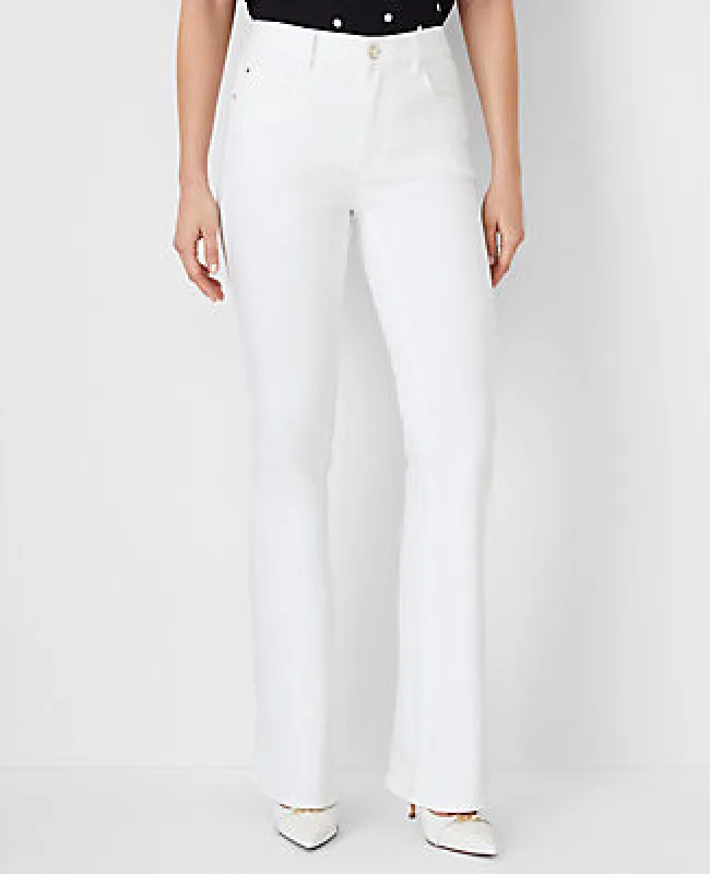 Ann Taylor Mid Rise Boot Jeans in White - Curvy Fit sold by Ann Taylor