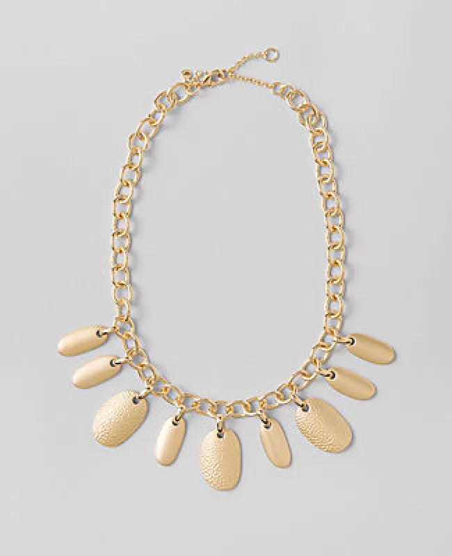 Ann Taylor Metal Charm Statement Necklace sold by Ann Taylor