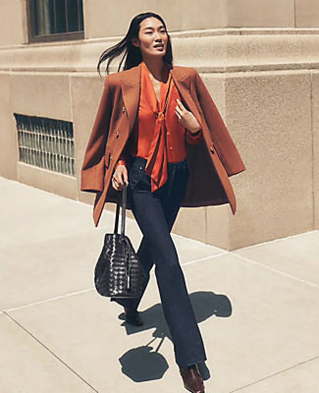 Ann Taylor Petite Mid Rise Boot Jean in Rinse Wash sold by Ann Taylor