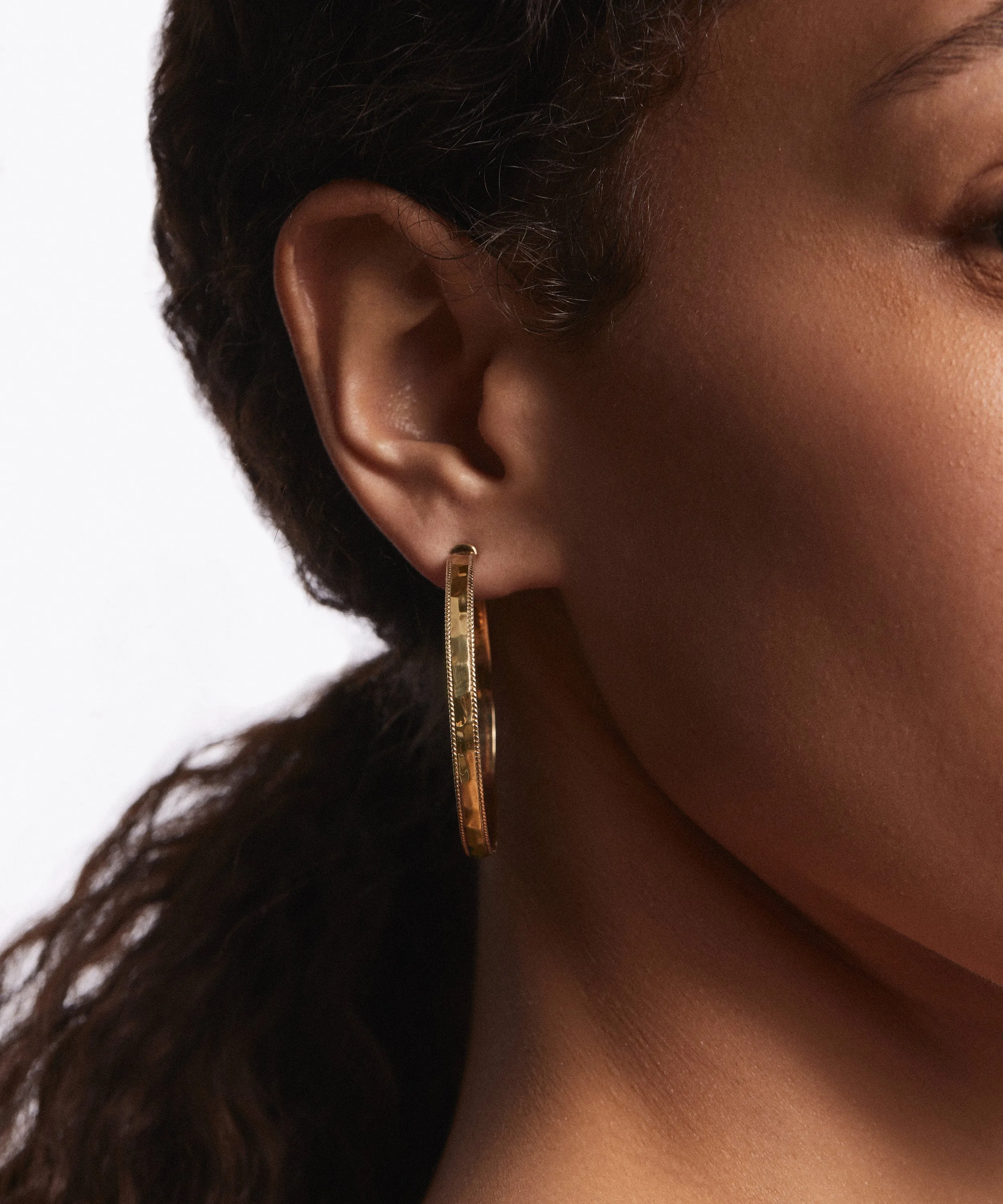 Large Hammered Hoop Earrings - Gold sold by Anna Beck product image thumbnail 2