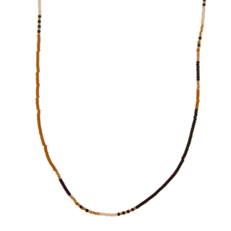 Black, White, Dark Yellow, and Gold Beaded Necklace sold by Anna Beck